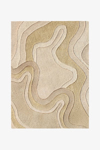 A square area rug with an abstract, layered topographic design in neutral beige, cream, and light tan tones, shown flat against a white background.