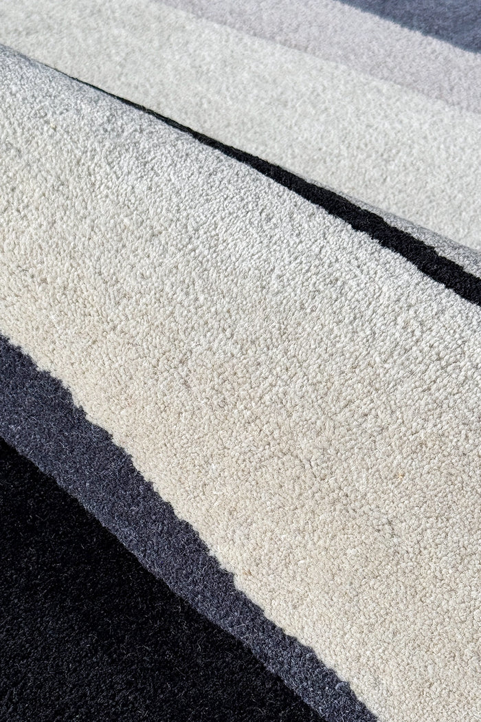 light gray wool rug surface texture close up silver