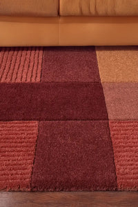 Terracotta block wool rug styled in living room, mid-century modern area rug in 6x9 or 8x10 size