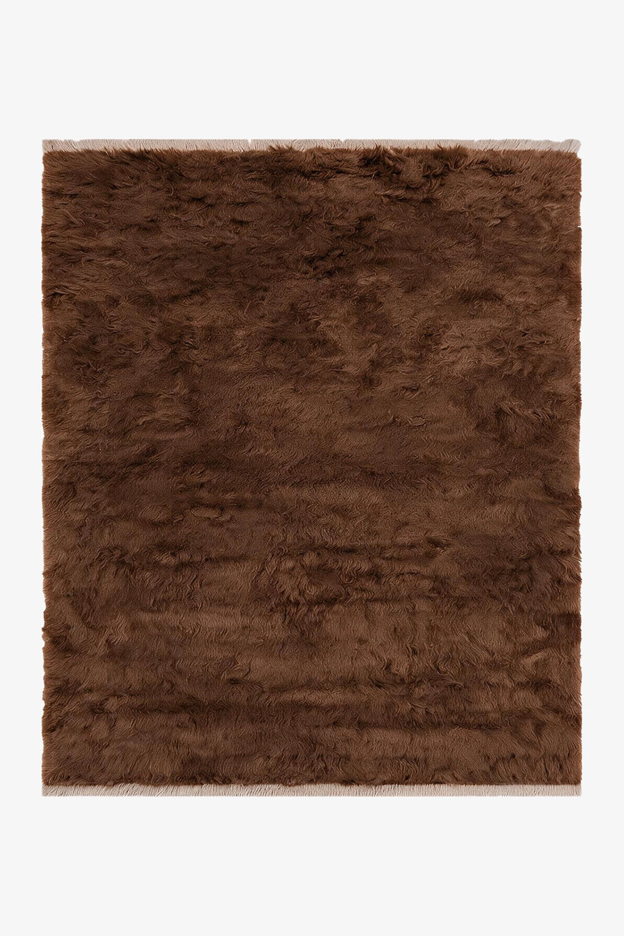 Umber brown hand-knotted shag wool rug with a deep 1.5 inch pile and pale natural fringe, a warm red-brown solid area rug for living rooms and bedrooms