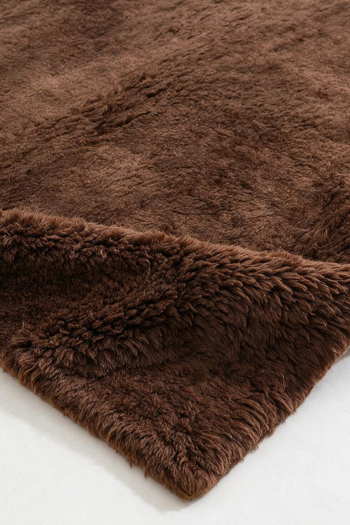 close up of a brown shaggy wool rug