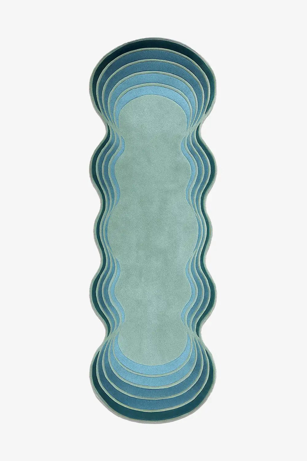 Wavy-patterned runner rug with gradient blue, green and teal colors on a white background