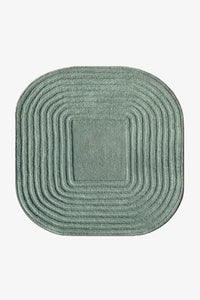 modern sage green square textured rug with rounded corners and sculpted stripes on a white background
