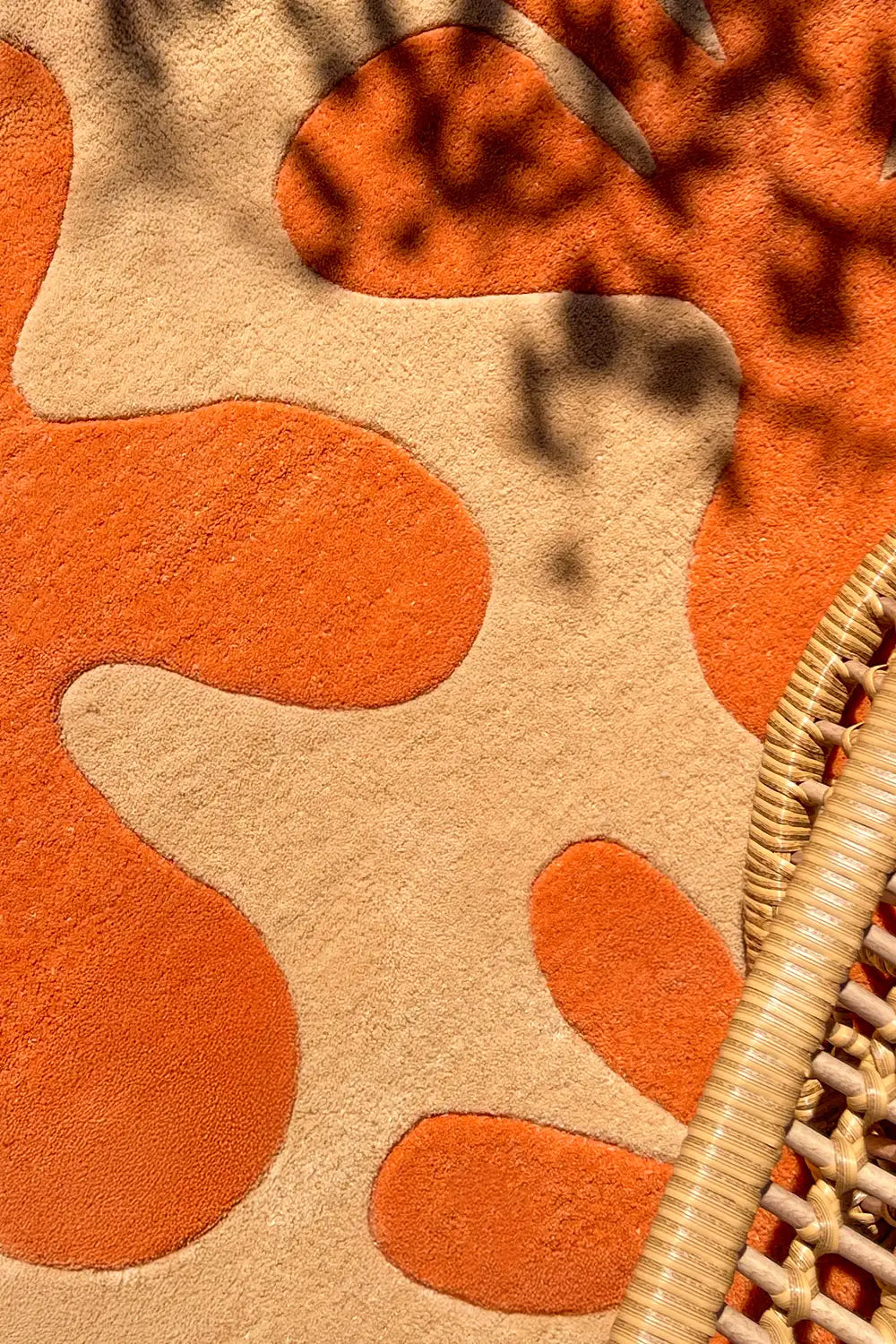 Hand-tufted 5x5 colorful wool rug with modern abstract design in bright orange lifestyle