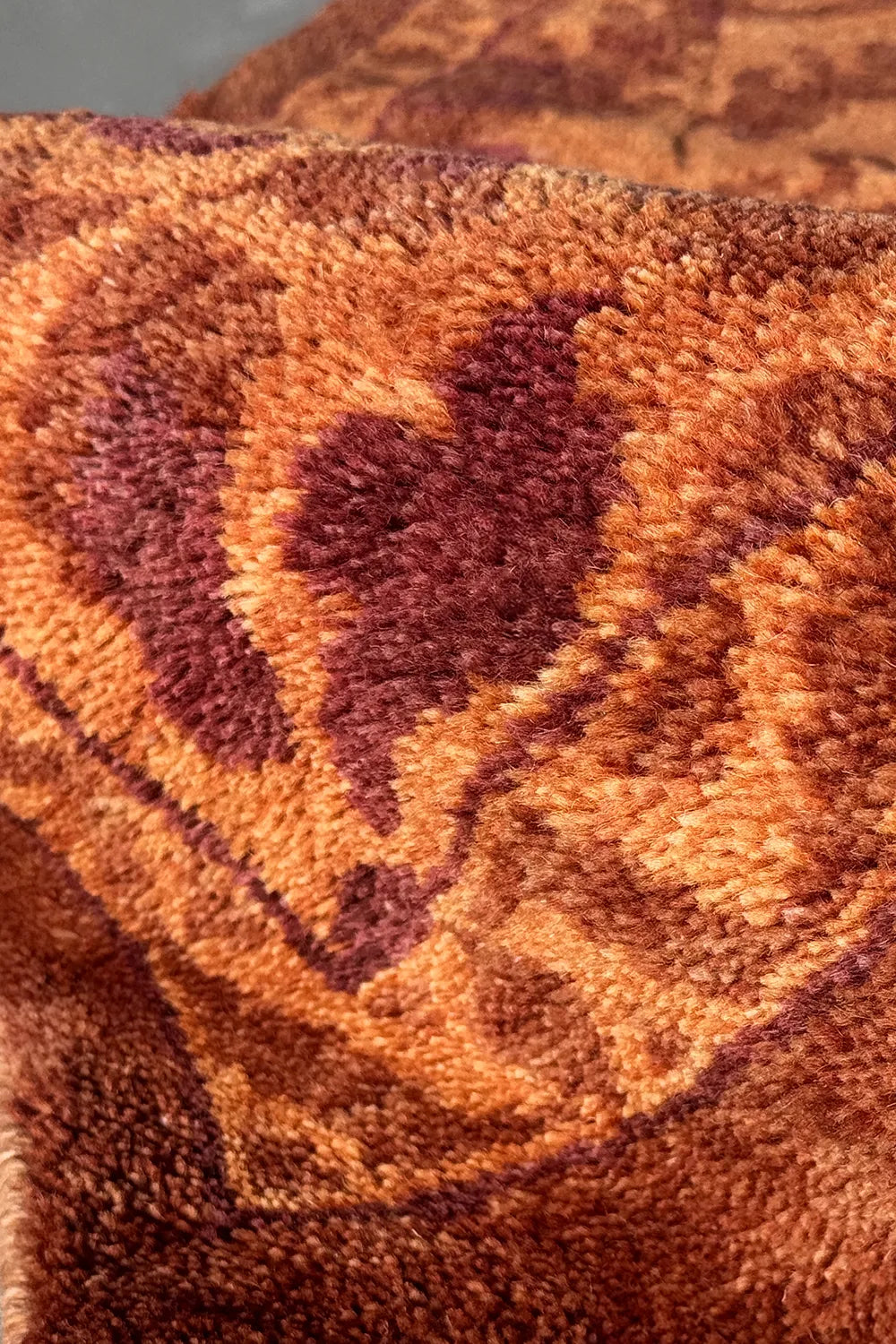 Amber Vine wool area rug featuring intricate vintage-inspired floral designs.