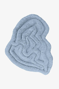 Modern light blue shag rug with irregular organic shape and thick plush texture, perfect for cozy bedrooms