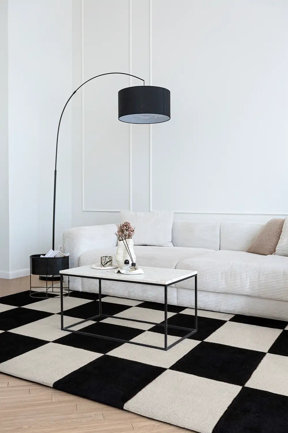 black and white checkered area rug in a contemporary living room