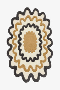 Cream and black scalloped wool rug with mustard center, bold modern living room or entryway rug
