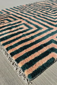 Angle view of vibrant hand-tufted wool shag rug, available in 6x9 and 9x12 sizes, perfect for bold modern rug statements