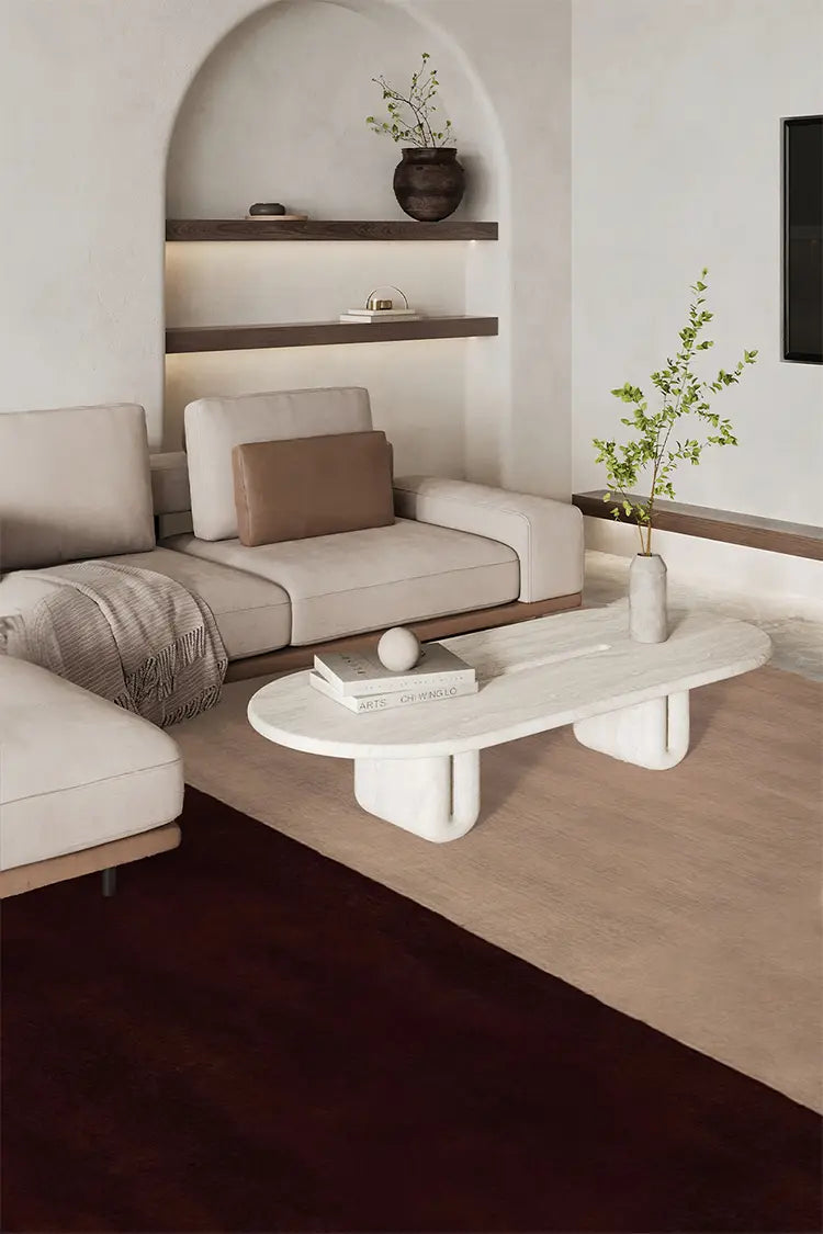 Neutral beige and brown area rug with color block design in a modern contemporary living room with organic decor