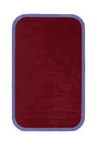 A rectangular rug in deep burgundy with a soft-textured surface, finished with a muted purple contour border.