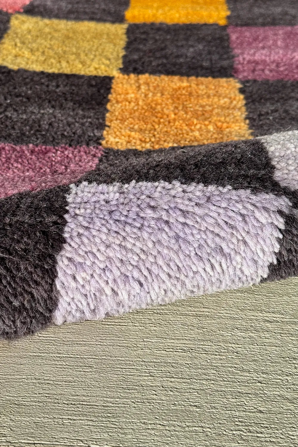 Luxurious hand-knotted rug in a vibrant multicolor checkered design for living rooms