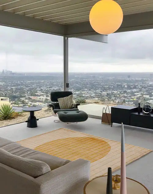 modern airy living room with a custom size gold area rug