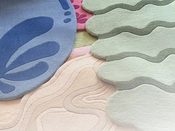 Completed bespoke rugs being carefully prepared for shipping