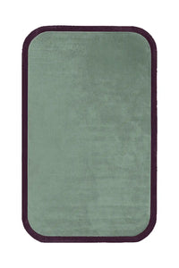 A plush sage green area rug featuring a rounded rectangular shape, accentuated with a dark brown contour edge