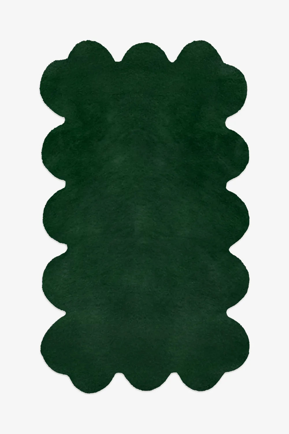 Dark green scalloped edge rug made from hand-tufted wool, perfect for mid century or eclectic living rooms

