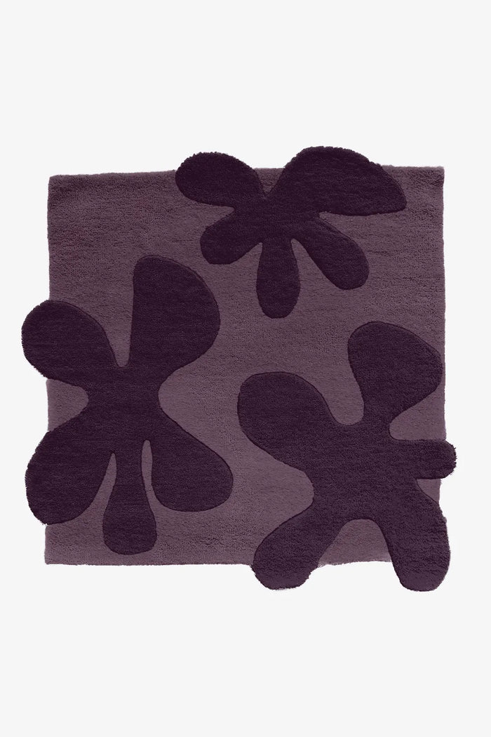 Deep plum floral square rug, bold modern wool rug for eclectic interiors