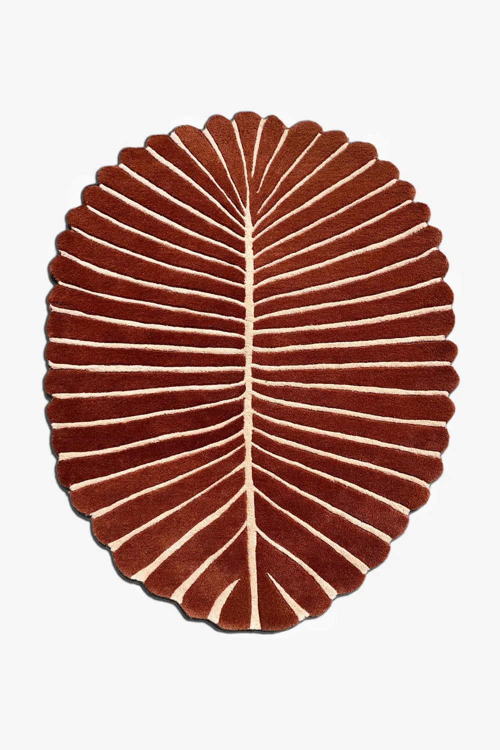 Oval leaf-shaped rug in terracotta and cream – handmade abstract wool rug with organic scalloped edges for modern coastal interiors