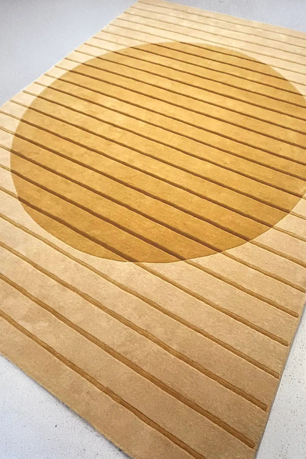 texture detail of golden geometry wool rug in neutral color palette