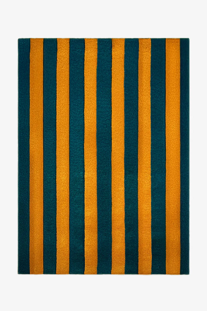 Green and gold striped rug with a plush hand-tufted wool texture.
