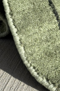 Versatile green wool area rug, ideal for living rooms, bedrooms, and dining spaces