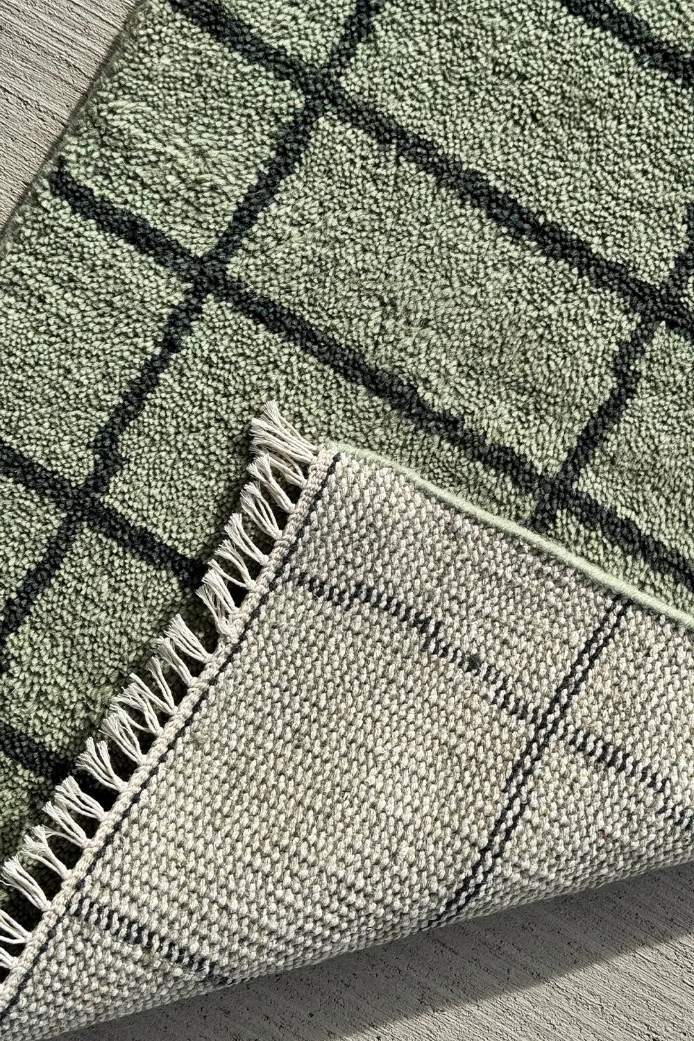 Close-up of the hand-knotted texture on the Modern Gridline Wool Runner Rug