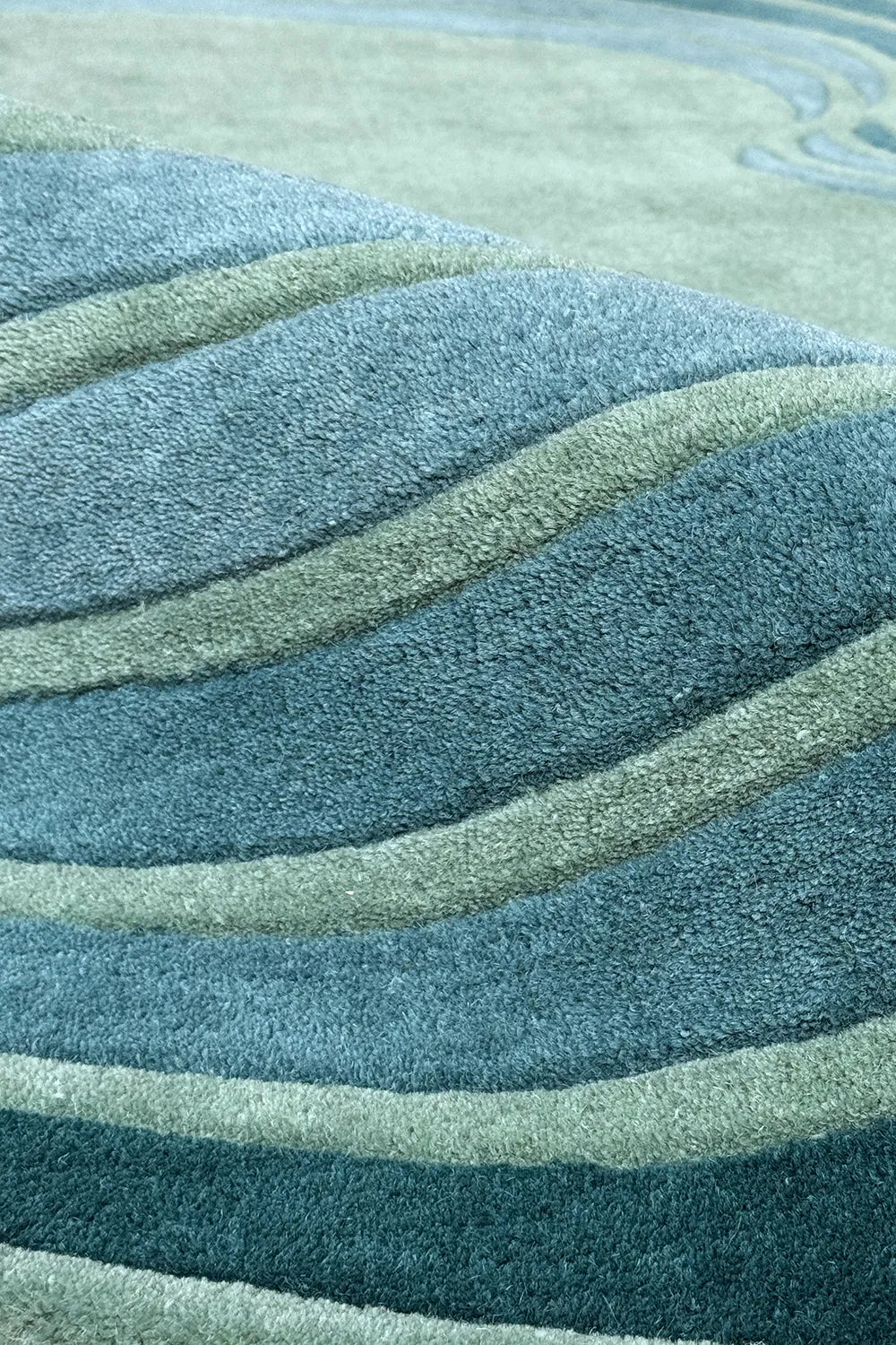 Modern wool rug in layered green and blue hues – colorful abstract geometric rug for kids rooms or bold living spaces