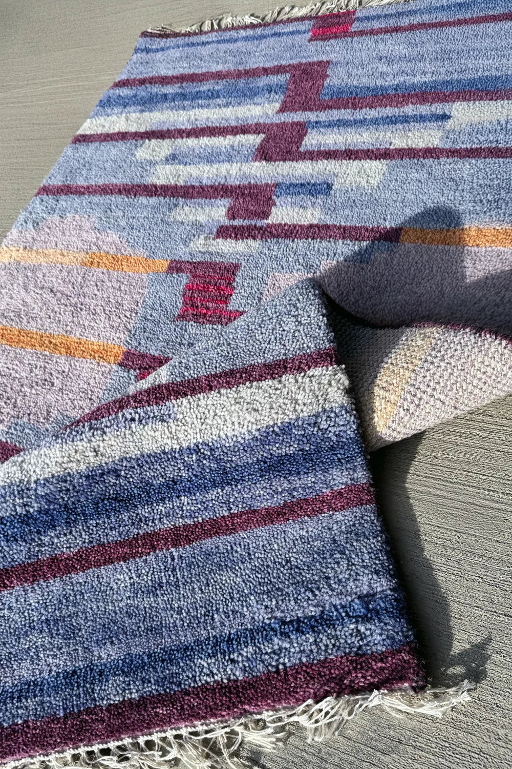 Artisan-crafted hand-knotted rug featuring bold, contemporary patterns