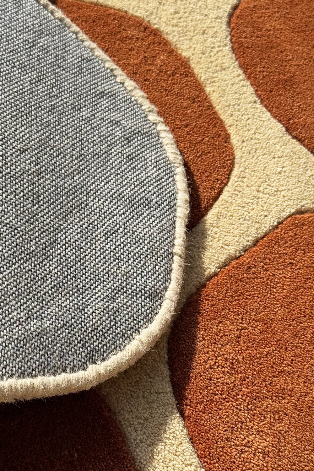 Textured detail of funky retro area rug – boho aesthetic rug in unique honeycomb design

