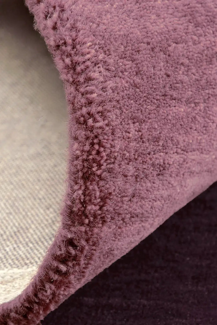 Mauve and burgundy area rug with high pile texture berry