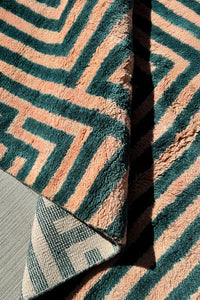 Detail of plush wool pile with rich deep green and pink stripes, ideal for custom colorful rugs and thick tufted wool designs