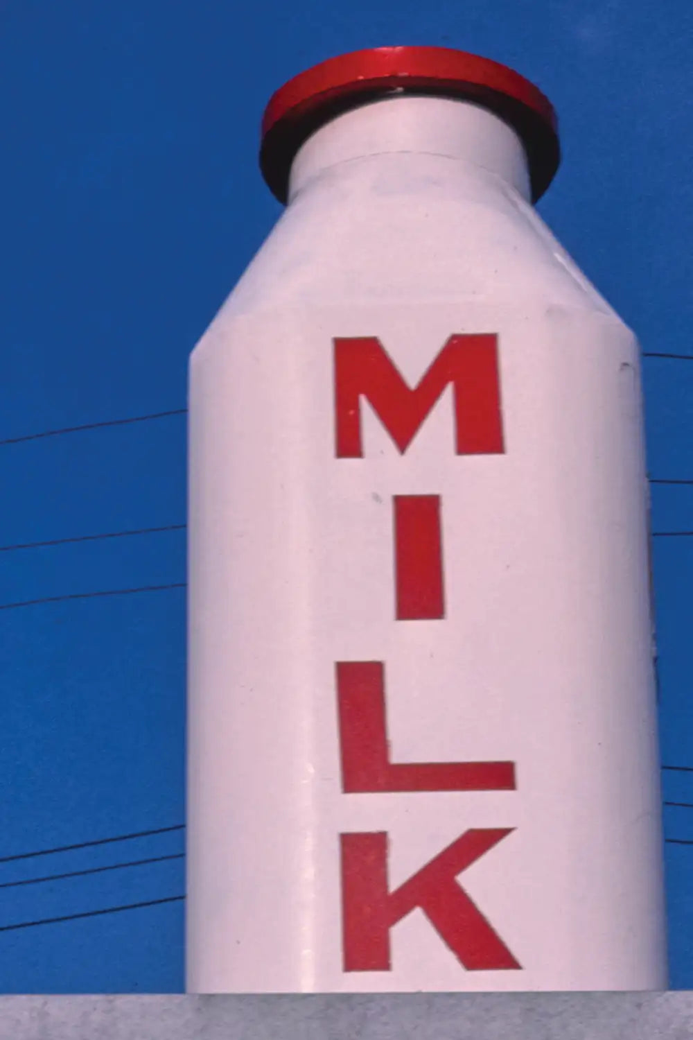 Nostalgic Americana photography featuring a giant milk bottle structure
