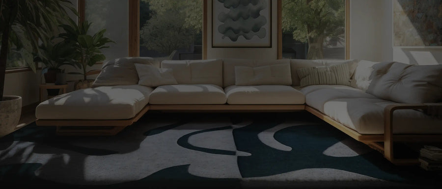 Modern living room featuring a Jubi custom rug, styled with deep blue tones and contemporary decor.