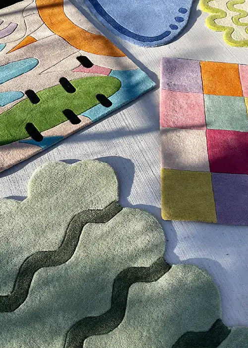 A vibrant display of colorful rug swatches, featuring playful patterns and bold hues, showcasing design versatility and creativity.