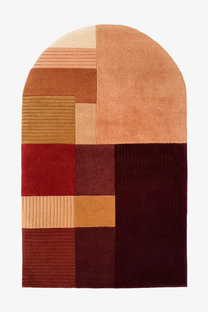 4x6 arch-shaped wool rug with hand-tufted color block design in burnt orange, brown, burgundy, ochre, and cream tones