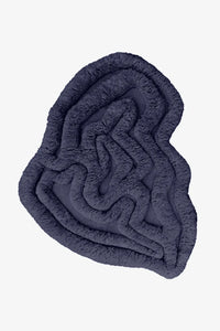 Dark navy irregular shaped shag rug with sculpted high-pile texture, ideal for modern living rooms or offices