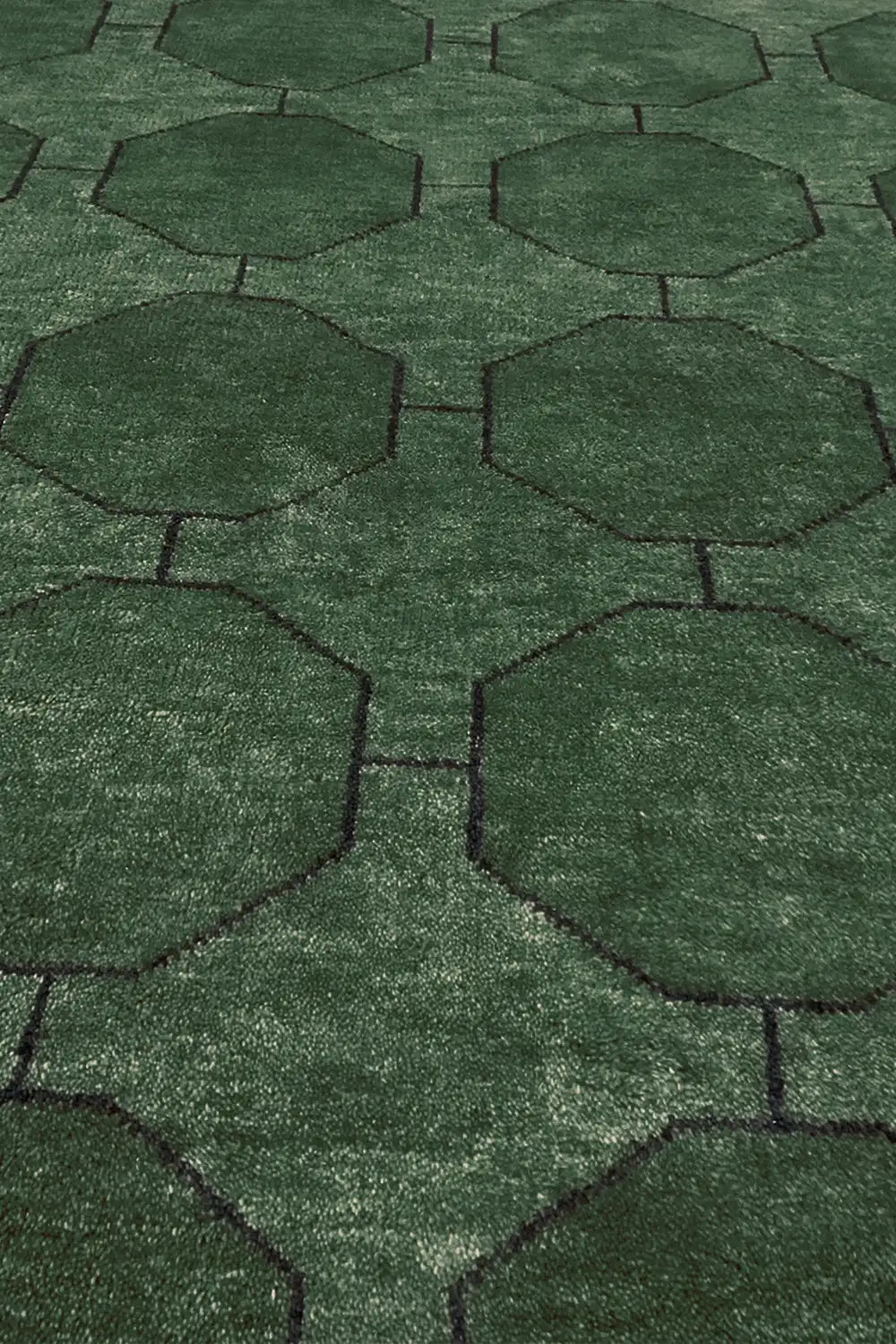 Hand-knotted geometric wool rug in rich dark forest green with octagon pattern
