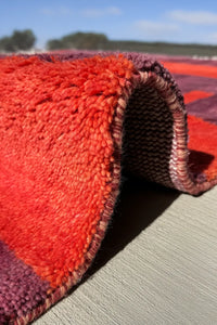 Rustic area rug in bold geometric stripes, perfect for modern farmhouse interiors
