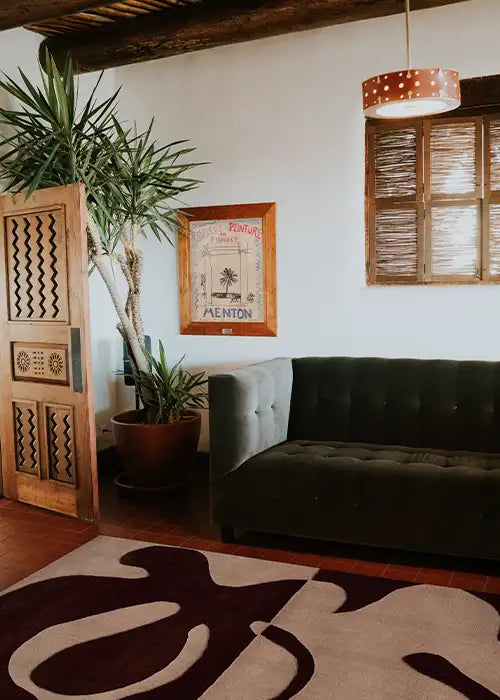 Abstract wool rug with modern colors styled in a southwestern-inspired entryway