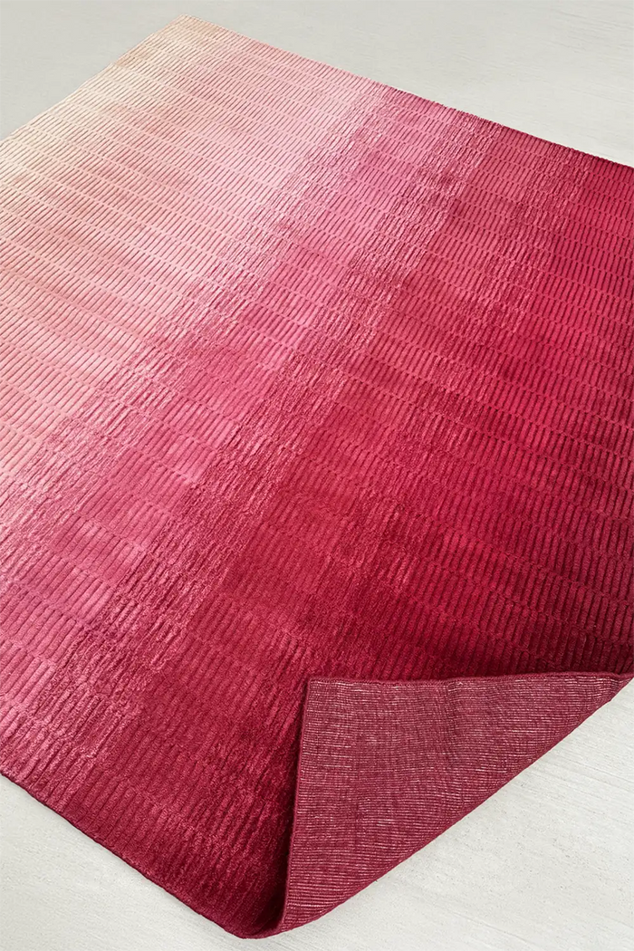 large pink area rug with magenta, medium pink, and blush tone ombre effect hand loomed from premium wool