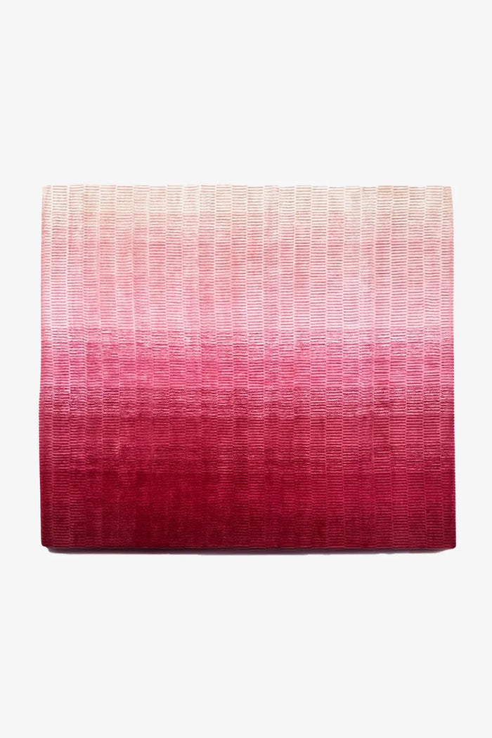 10x10 rug in a hand-loomed pink ombre design crafted by artisans from wool