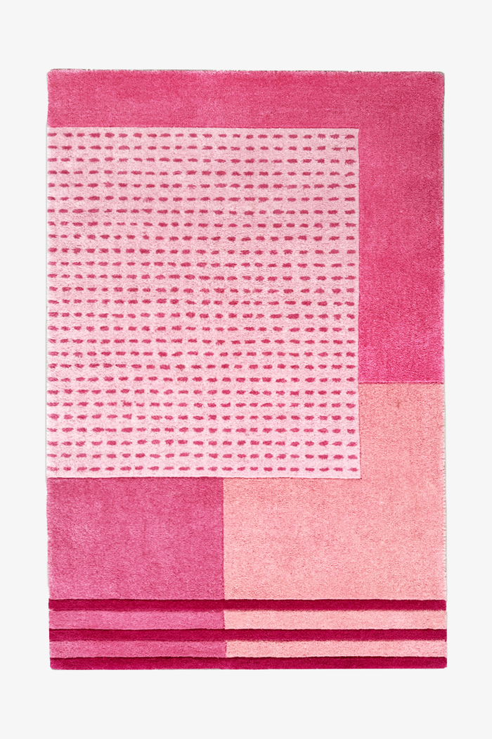 5x8 pink modern wool rug with geometric blocks, dotted texture, and sculpted striped border design