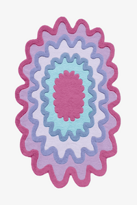 Bright rainbow scalloped wool rug in pink, red, blue, and cream, colorful modern wool area rug for eclectic interiors