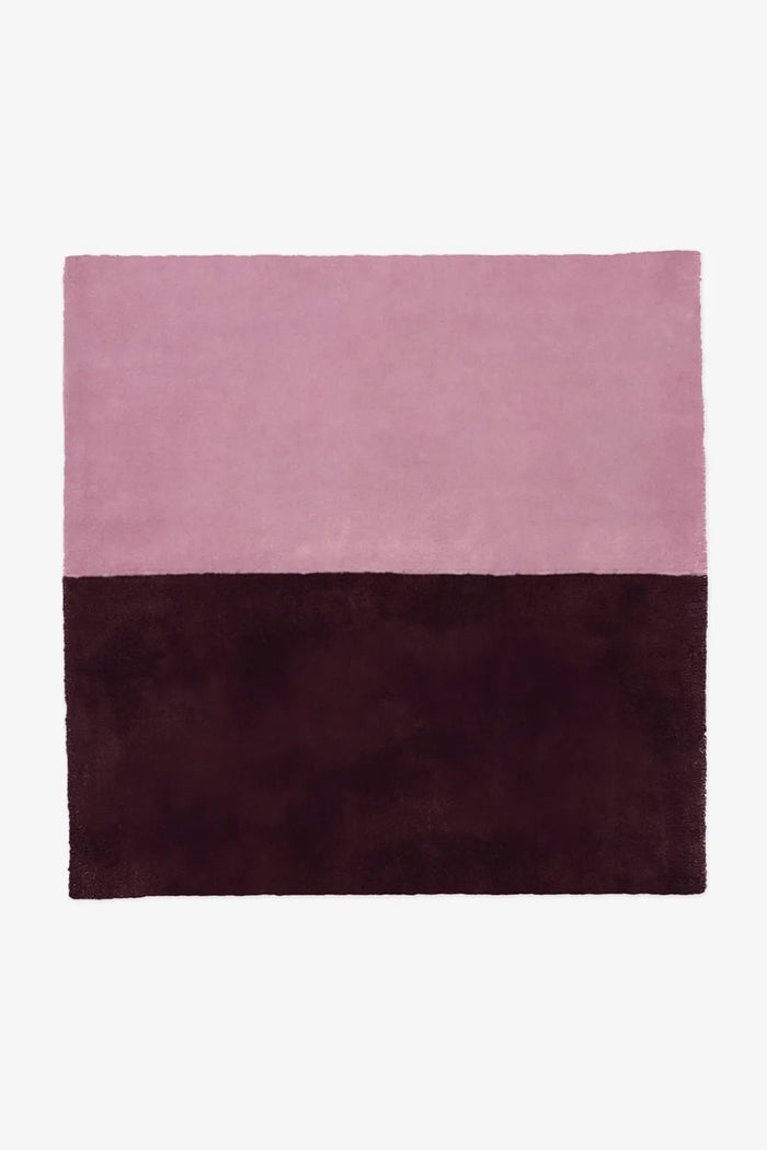 Two-tone pink and dark plum wool square rug in 8x8 or 9x9 sizing, perfect for playful modern bedrooms, artistic living spaces, or contemporary boho interiors berry