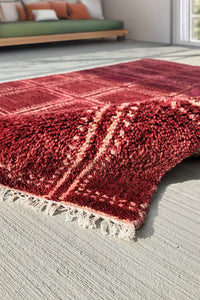Large Oushak rug in red with a hand-knotted wool texture lifestyle