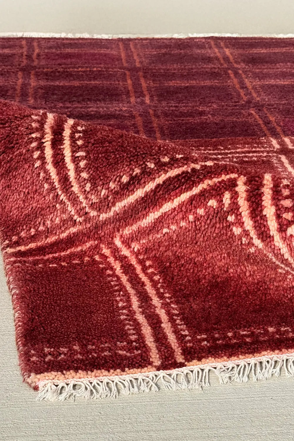 Southwestern rug with geometric red  pattern