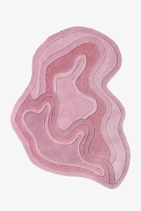 Pink organic shaped rug with sculptural curves, ideal for nursery rugs, funky throw rugs, or custom shaped rugs for bedroom or living room rose
