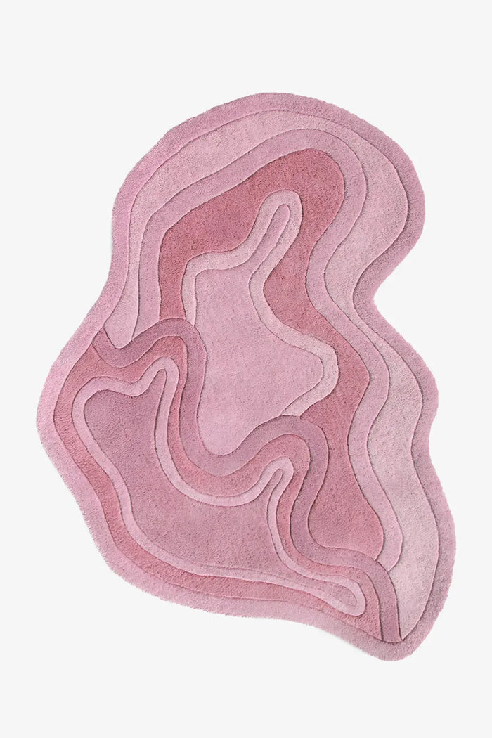 Pink organic shaped rug with sculptural curves, ideal for nursery rugs, funky throw rugs, or custom shaped rugs for bedroom or living room rose