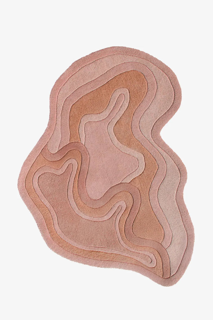 Rust colored abstract shape rug with wavy edge, suited for boho rugs, 5x7 wool area rugs, or custom rugs for bedroom and entryway
