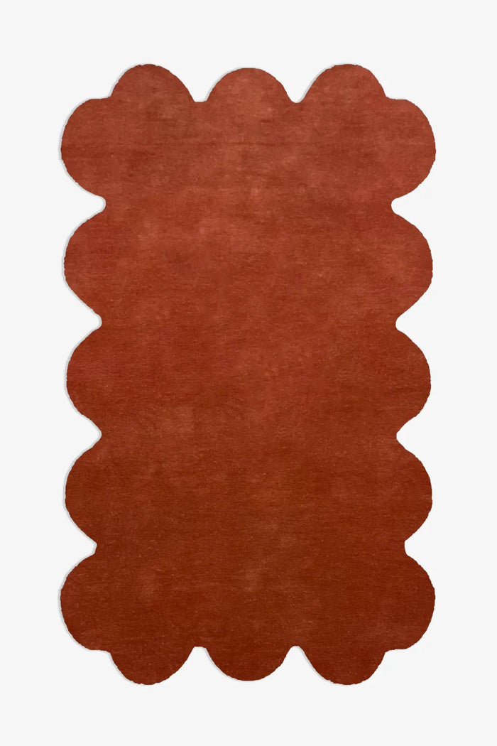 8x10 rust burnt orange scalloped edge wool rug with sculptural silhouette, perfect for modern boho living rooms